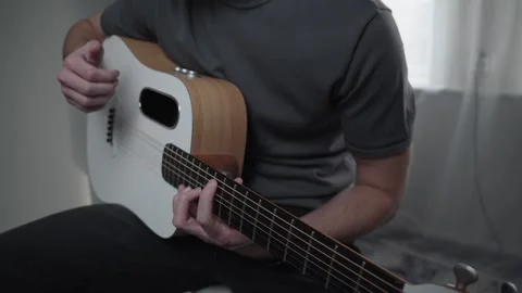 Medium Shot of Man Playing Acoustic Guitar at Home Vídeo Stock 329561195