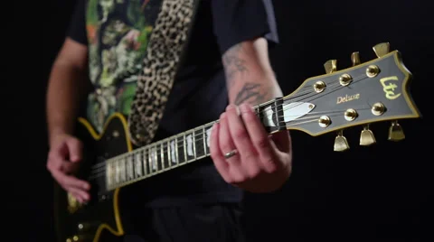 Medium shot of man playing electric guitar in studio 4K Vídeo Stock 41466050