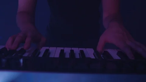 Medium shot of man playing the keyboard Stock Footage 127131127