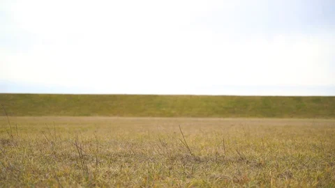 Medium shot of man pushing a bicycle in the countryside, Croatia. Video stock 127220364