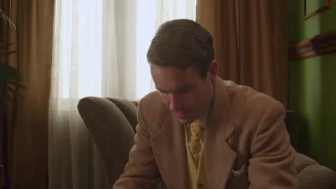 Medium shot of a man reads a letter and smiles, 1950s, USA - Reenactment Stock Footage 245290508