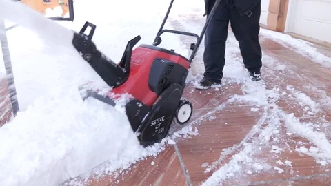 Medium Shot of Man with Snow Blower, daytime, snow Stock Footage 86752337