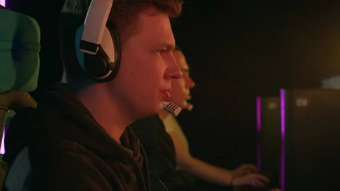 Medium shot of a man speaking into a microphone while playing a video game Stock Footage 151036596