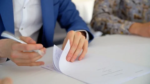 Medium Shot Of A Man In Suit Drawing On Paper Stock Footage 129398999