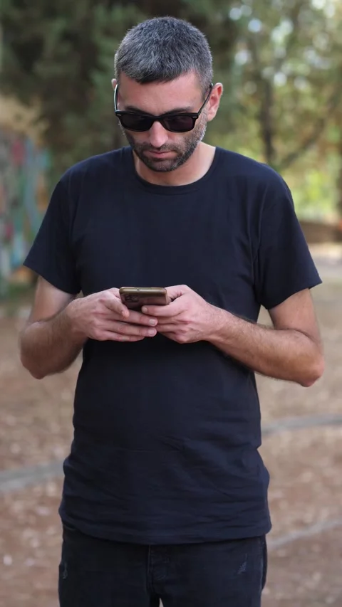 Medium Shot of Man Typing a Message on Smartphone Stock Footage 284234318