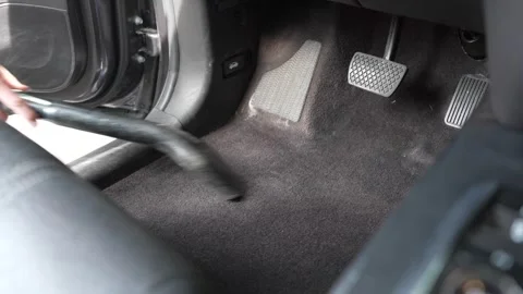Medium Shot Man Vacuuming Car Interior Driver Side Floor 4K Stock Footage 336448220