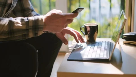 Medium shot of man working on laptop at home office Stock Footage 95392090