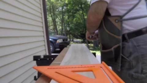 Medium shot of measuring to length  Stock Footage 81714491