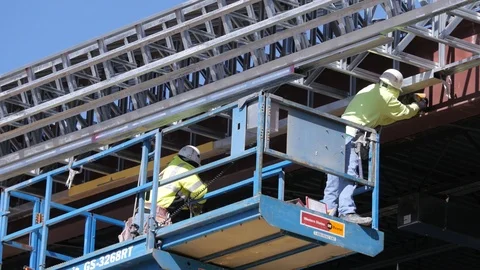Medium Shot Men Working On Lift, Construction Stock Footage