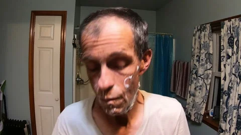 A Medium Shot of a Middle-Aged Man Shaving Vidéo 159321237