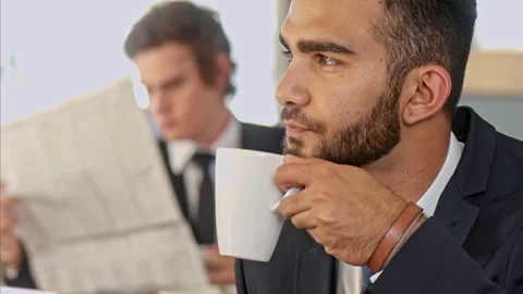 Medium shot of middle eastern business man enjoying his coffee break, ofter his Stock Footage 199633931