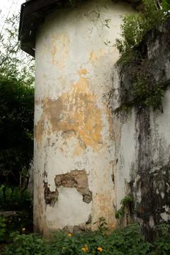 Medium shot of old corner guard tower at colonial era prison in Southeast Asi Stock Photos