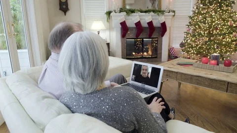Medium shot of an old couple video chatting 動画素材 73110839