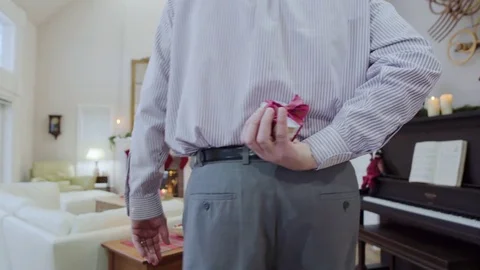 Medium shot of an old man giving a gift for his wife 動画素材 73107734