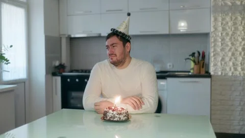 Medium Shot One Crying Man Sitting Alone With Lit Birthday Cake Video stock 333256081