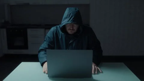 Medium Shot One Focused Hacker In Hoodie Looking Closely At Laptop Stock Footage 333270643