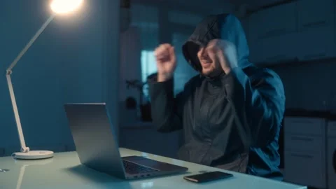 Medium Shot One Hacker In Hoodie Celebrating Then Crying At Laptop Stock Footage 333270687