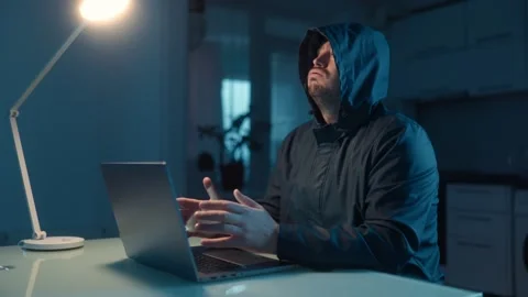Medium Shot One Man In Hoodie Typing On Laptop At Night Thinking Stock Footage 333270656