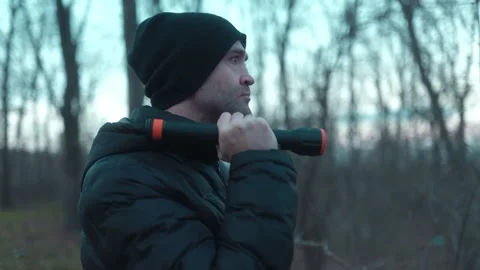 Medium Shot One Man Turning On Flashlight In Dark Forest lifestyle Stock Footage 334001970