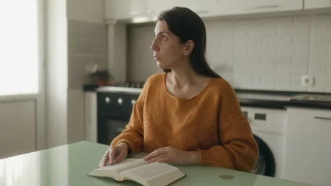 Medium Shot One Woman Reading Bible And Looking Away Thoughtful Stock Footage 334041130