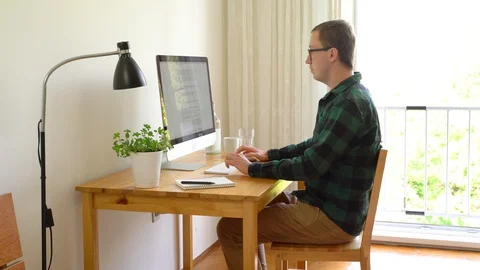 Medium shot of pensive men taking notes after reading text, working from home. Stock Footage 128765475
