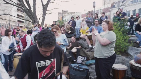 Medium shot of people and drummers play drums during Drum circle Stock Footage 103434091