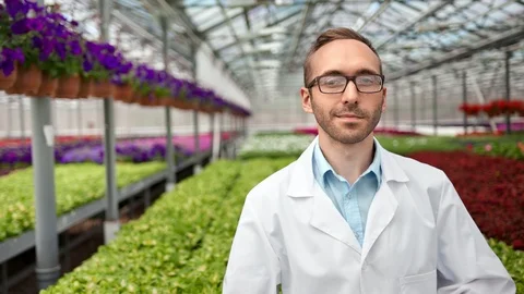 Medium shot portrait of smiling confident male science farmer posing in Stock Footage 108606877
