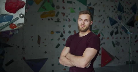 Medium shot portrait of a young bearded climber with crossed arms Stock Footage 131362417