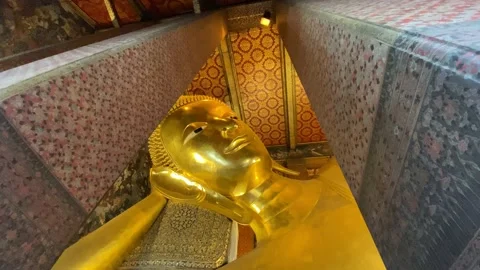 A Medium Shot of The Reclining Buddha Face at Wat Pho, Thailand Stock Footage 234591054