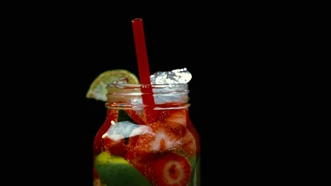 MEDIUM SHOT ROTATING LIME STRAWBERRY SODAWATER IN JAR 動画素材 93972618