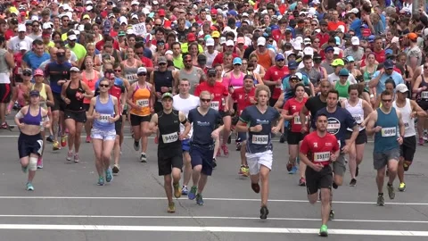 Medium shot of runners in a marathon Stock Footage 139977285