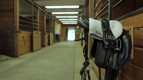 MEDIUM SHOT of saddle in stable Stock Footage 68420270