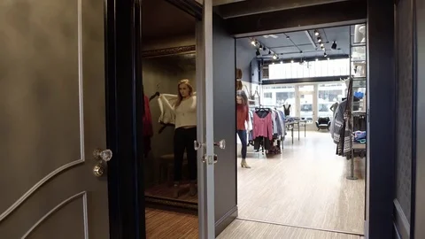 Medium shot of a sales worker assisting a customer Stock-Footage 76215740