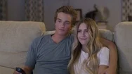 Medium Shot Of Shy Boy Putting Arm Around Girl On Sofa / Cedar Hills, Utah, Stock Footage