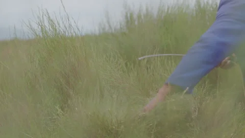 Medium shot, Sickle Cutting Through Rooibos Tea leaves Stock Footage 236552666