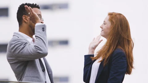 Medium shot side view of amused young female entrepreneur holding digital tablet Stock Footage 278011358