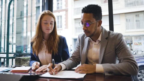 Medium shot side view of amused young female entrepreneur holding digital tablet Stock Footage 278012241