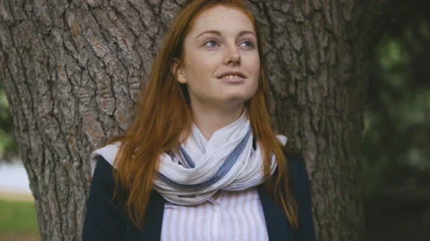 Medium shot side view of amused young female entrepreneur holding digital tablet Stock Footage 278012585