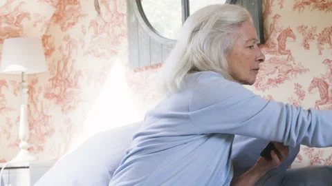 Medium shot side view of amused young female entrepreneur holding digital tablet Stock Footage 278012806