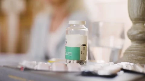 Medium shot side view of amused young female entrepreneur holding digital tablet Stock Footage 278012873