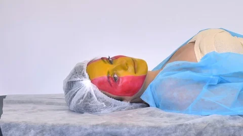 Medium shot side view portrait of smiling spanish woman (football fan, flag of Stock-Footage 126870721