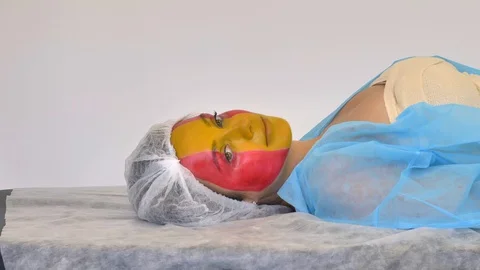 Medium shot side view portrait of smiling spaniard woman (football fan, flag of Vídeos de archivo 128065575