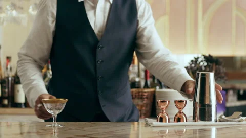 Medium shot of skillfull flair mixologist flipping shaker in a beautiful modern Stock Footage 199457144