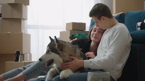 Medium shot. A slender man gently hugs his beloved girlfriend. A happy couple is 스톡 동영상 150353243