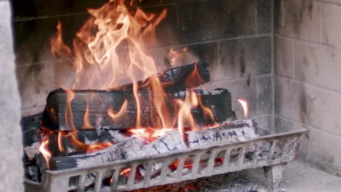 Medium shot, slow motion fire in a fireplace Video stock 137138234
