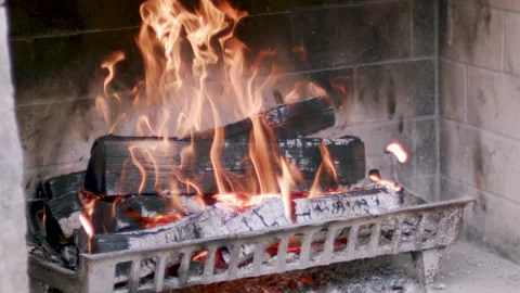Medium shot, slow motion fire in a fireplace Video stock 137138236
