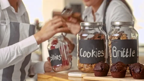 Medium shot of small business coffee shop staff taking stock take of everyday co Stock Footage 199633923