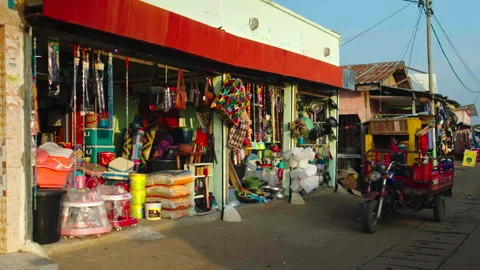 Medium shot of storefront with towed motorcycle on right 库存影片 338167718