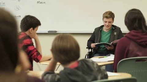 Medium shot of student presenting to class 動画素材 73304701