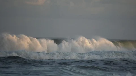 Medium shot of surge of waves close to sunset at beautiful beach in South Africa Video stock 111274283